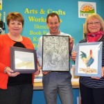 Art for charity- Painter and volunteer Helen Dale, Will Marsh, manager of Ashby Hospice Bookshop and tutor Lynda Houghton