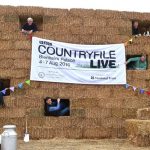 BBC Countryfile presenters pose in a sixteen foot “haystack” at Blenheim…